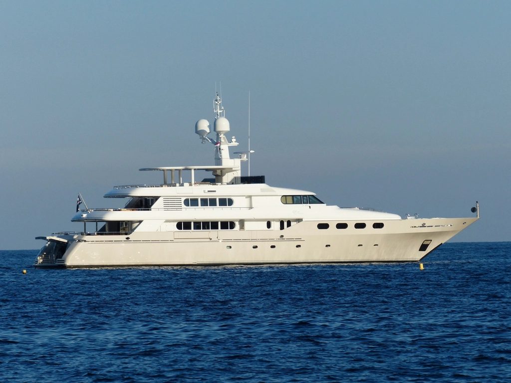 White superyacht cruising on a deep blue sea